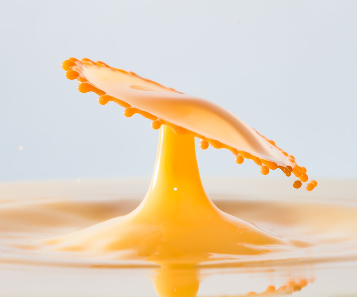 Orange drink splashing